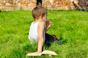 bored boy with book